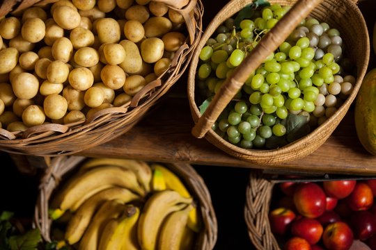 Various fruits and vegetables in wicker basket 