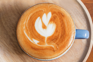 Top view of coffee cup on table.