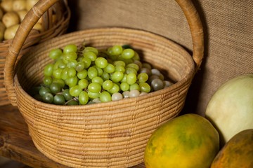 Close-up of fresh grapes in wicker basket