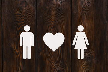 Paper man and woman with heart. Abstract conceptual image