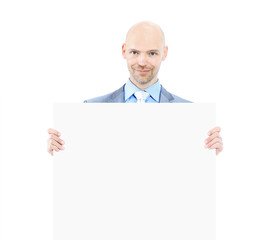 Nice businessman holds white poster. Isolated on white background.