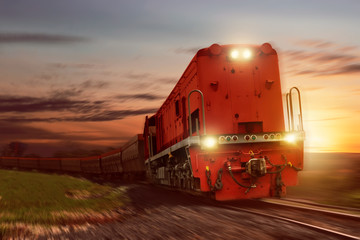 Freight train with cargo cars carrying coal