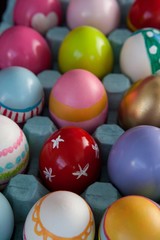 Fototapeta na wymiar Colorful Easter eggs in egg carton