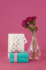 Gift box, paper bag and flowers vase