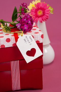 Happy mothers day card and flowers on gift boxes