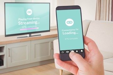 Composite image of female hand holding a smartphone