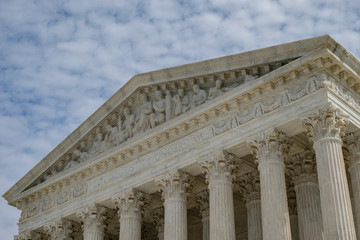 U.S. Supreme Court - roof closeup with blue sky and clouds