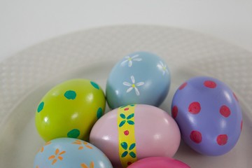 Painted Easter eggs arranged in plate