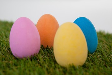 Painted Easter eggs arranged on grass