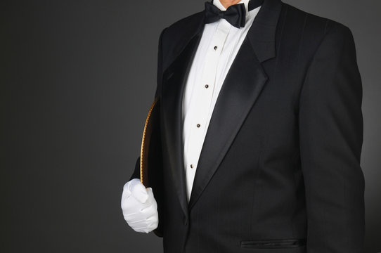 Waiter Holding Serving Tray Under His Arm