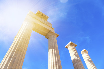Ancient Greek columns on a background of blue sky