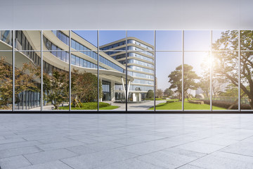 Fototapeta na wymiar The modern office buildings from glass window