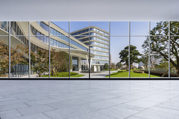 The modern office buildings from glass window