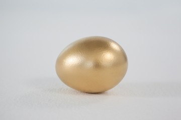 Golden eastern egg on white background