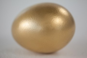 Golden eastern egg on white background