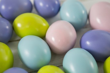 Fototapeta na wymiar Multicolored Easter eggs on wooden surface