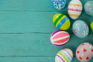 Painted Easter eggs on wooden plank
