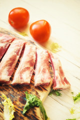 raw pork ribs on a cutting board