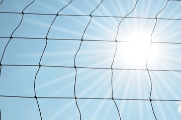 Close up Simple sport safety net against a cloudy sky with Lighting of hope.