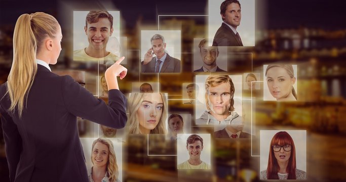 Composite image of businesswoman pointing somewhere