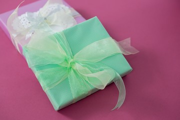 Gift boxes against pink background