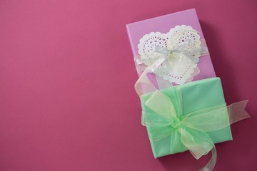 Gift boxes against pink background