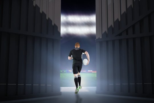 Composite image of rugby player running with a rugby ball 3d