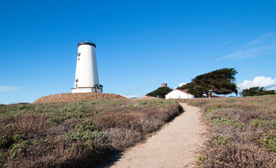 Lighthouse at Piedras Blancas point at cloudy sunset on the Central Coast of California USA