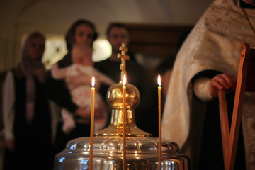 Fototapeta na wymiar candles fire on ceremony of Epiphany