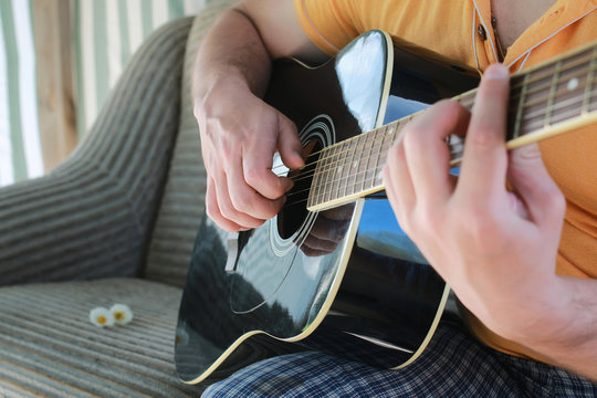 guitar string man hand outdoor