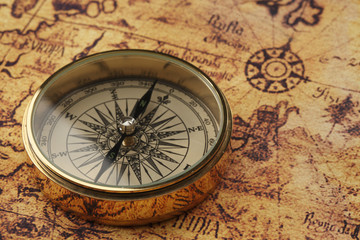 Fototapeta na wymiar old compass on vintage map 
