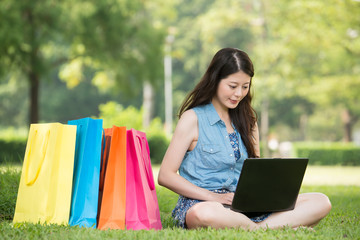 beautiful asian woman using computer shopping online