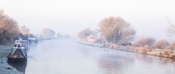 The Gloucester and Sharpness Canal on a cold winter's morning, from Patch Bridge, Gloucestershire, England, UK.