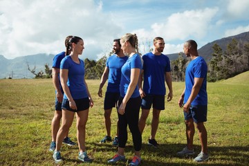 People interacting with each other during boot camp training