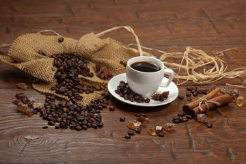 White cup of coffee with beans