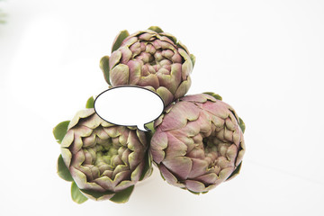 Fototapeta premium Artichokes bunch and white market label