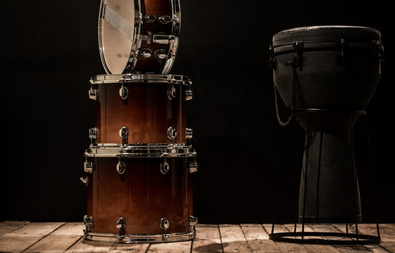 musical percussion instruments on black background drum Bongo and snare