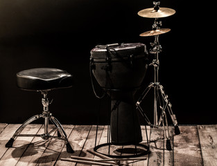 musical percussion instruments on black background