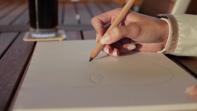 Young artist painting her boyfriend portrait