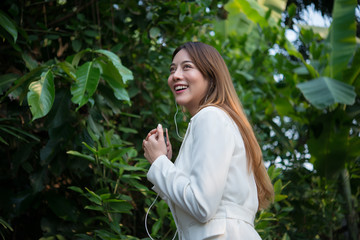 beautiful business woman listening music for relax from work