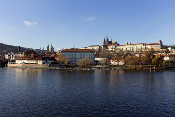 Fototapeta premium View on the colorful autumn Prague gothic Castle above River Vltava, Czech Republic