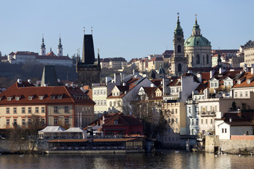 View on the autumn Prague St. Nicholas' Cathedral above River Vltava, Czech Republic