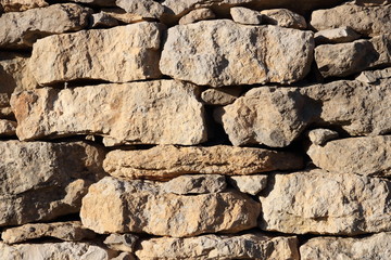 Fond de mur de pierre séche