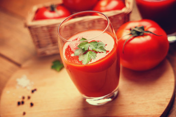 Glass of fresh tomato juice and tomatoes 