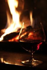 glass of wine with fireplace