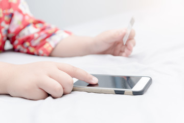 Online shopping.Hands holding credit card and using smartphone.