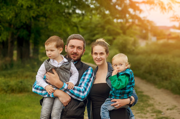 Fototapeta premium Happy young family together outside in nature.