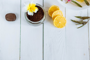 Spa and bathroom aromatherapy accessories with lemon fruit. white wooden background close-up copyspace