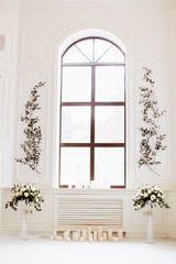 beautiful decoration with flowers near the window