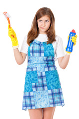 Tired young woman holding bottle of chemistry for cleaning house. Cleaning concept. Beautiful girl with cleaning tools and products on white background. Housekeeper isolated portrait.